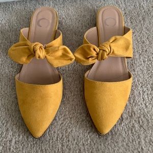Yellow mule flats with bow